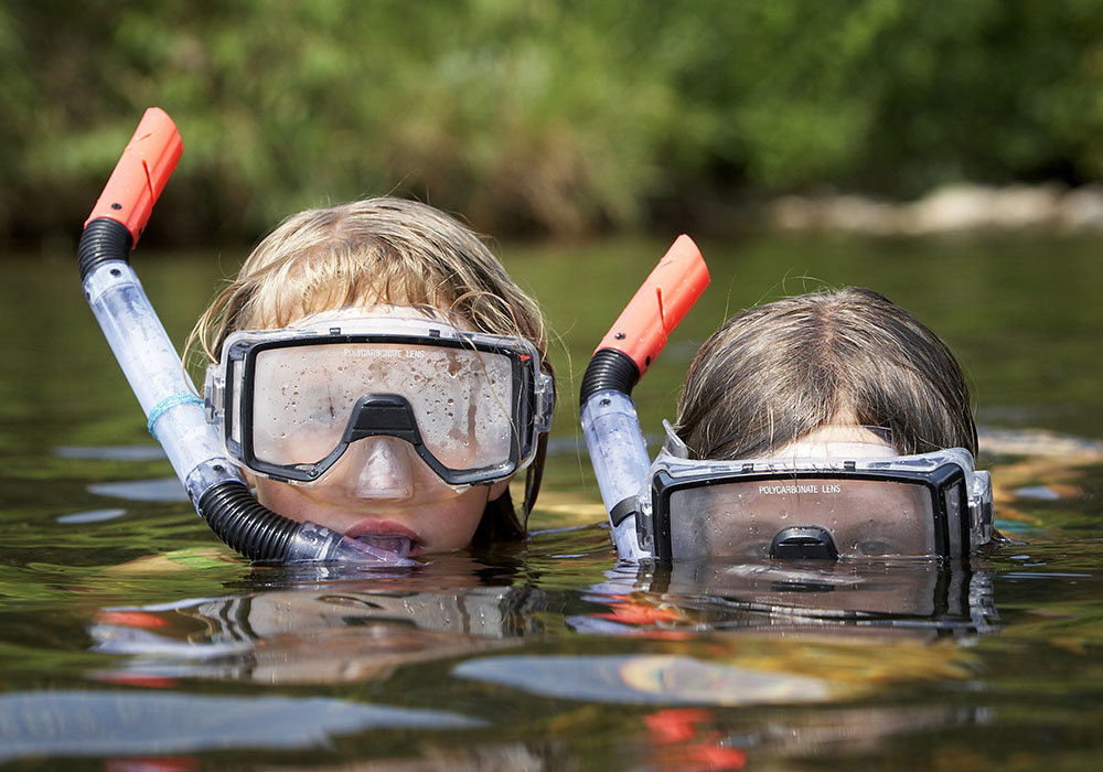 Two,Small,And,Young,Children,Playing,At,The,River,On